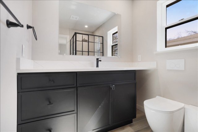 Modern vanity with matte black faucet
