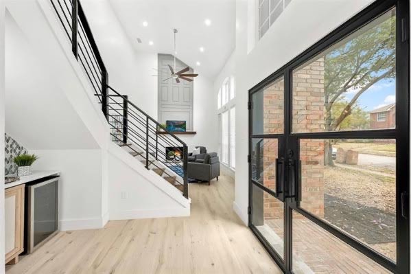 Full home renovation with open entry, floating stairs and steel doors